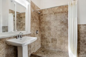Bathtub, hair dryer, towels, soap