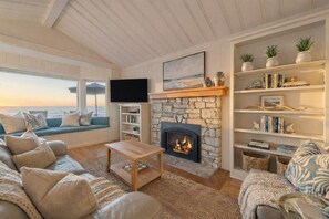 Smart TV, fireplace, books, stereo