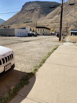 Guests can park adjacent to the building with a flat roof.