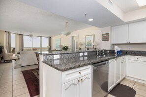 Fridge, dishwasher, coffee/tea maker, cookware/dishes/utensils