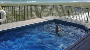 A hot tub on a deck with a view of the ocean. - Gulf Front, 3 Gulf Front Master Suites, Heated Balcony Pool  (Navarre)
