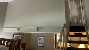A staircase with a handrail and a door at the top. - Best Location Ski In/Out Condo @ Boyne Mountain- Walk To Village (Boyne Falls)