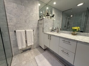 Combined shower/tub, hair dryer, towels, soap