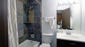 Combined shower/bathtub, hair dryer, towels, soap