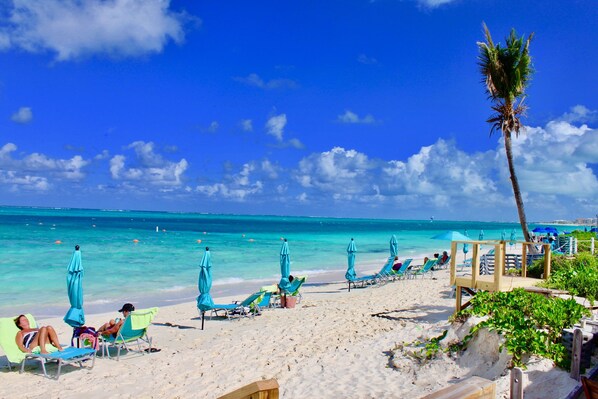 On the beach, sun loungers, beach towels