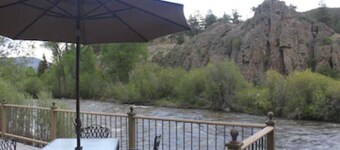 COTTAGE ON THE CREEK VACATION RENTAL. Sleeps 4. Beautiful views. Riverside deck. Fishing.