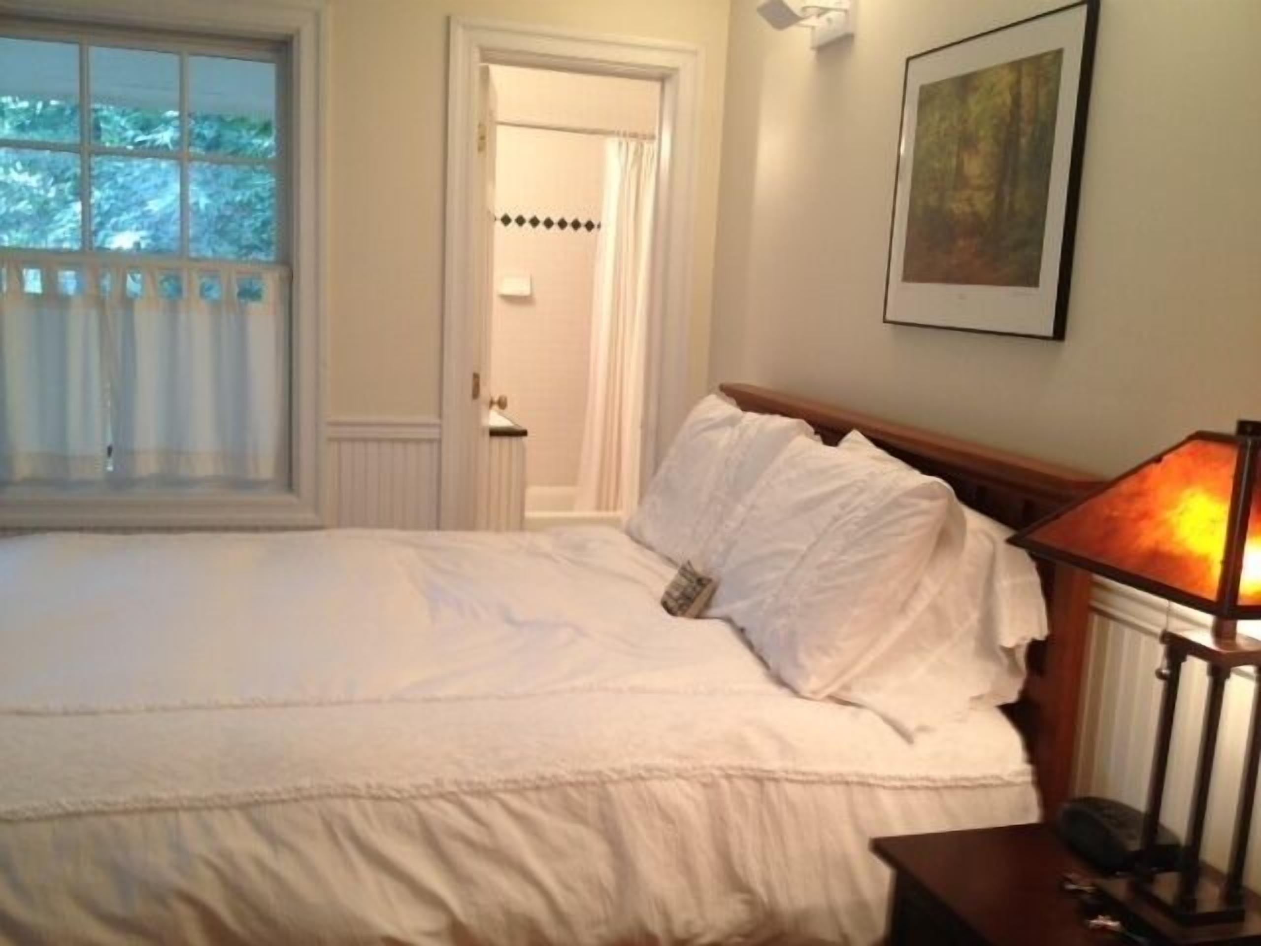 Short walk to village...with private wooded setting. EV Charger in parking area.