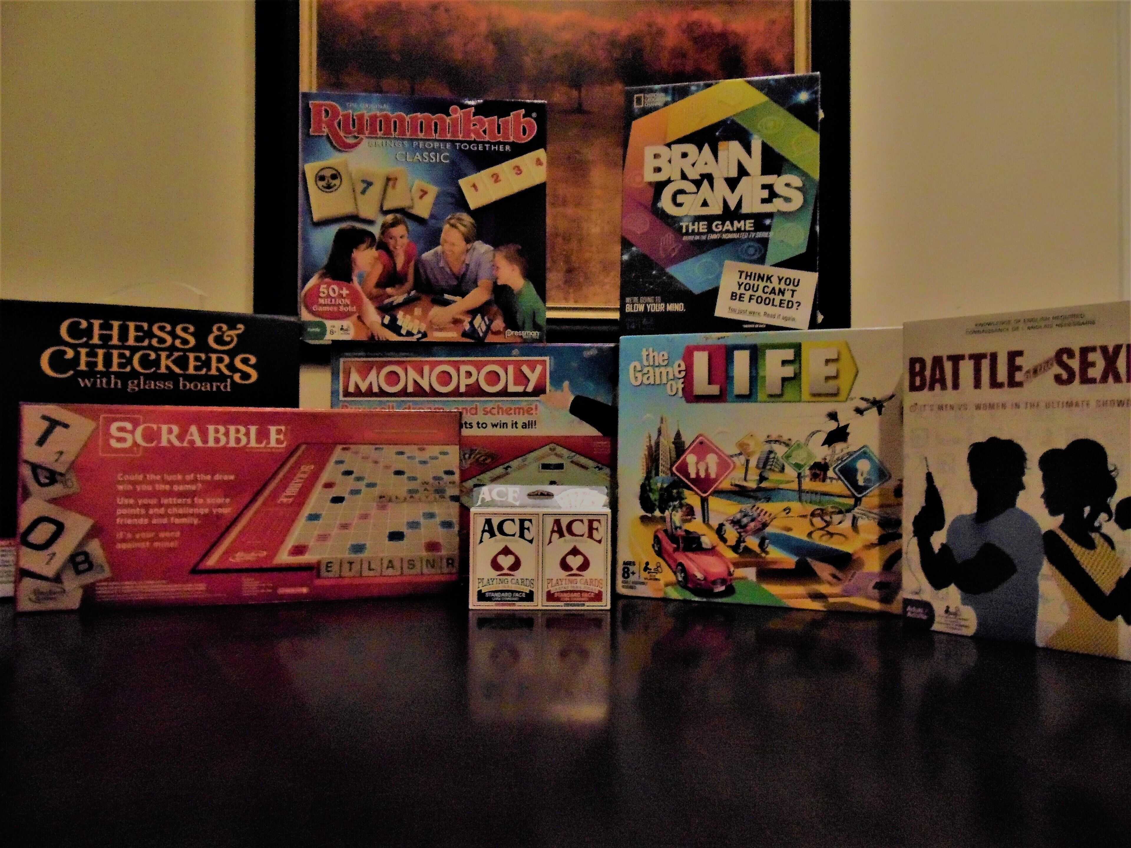 A collection of board games including Scrabble, Monopoly, and others.