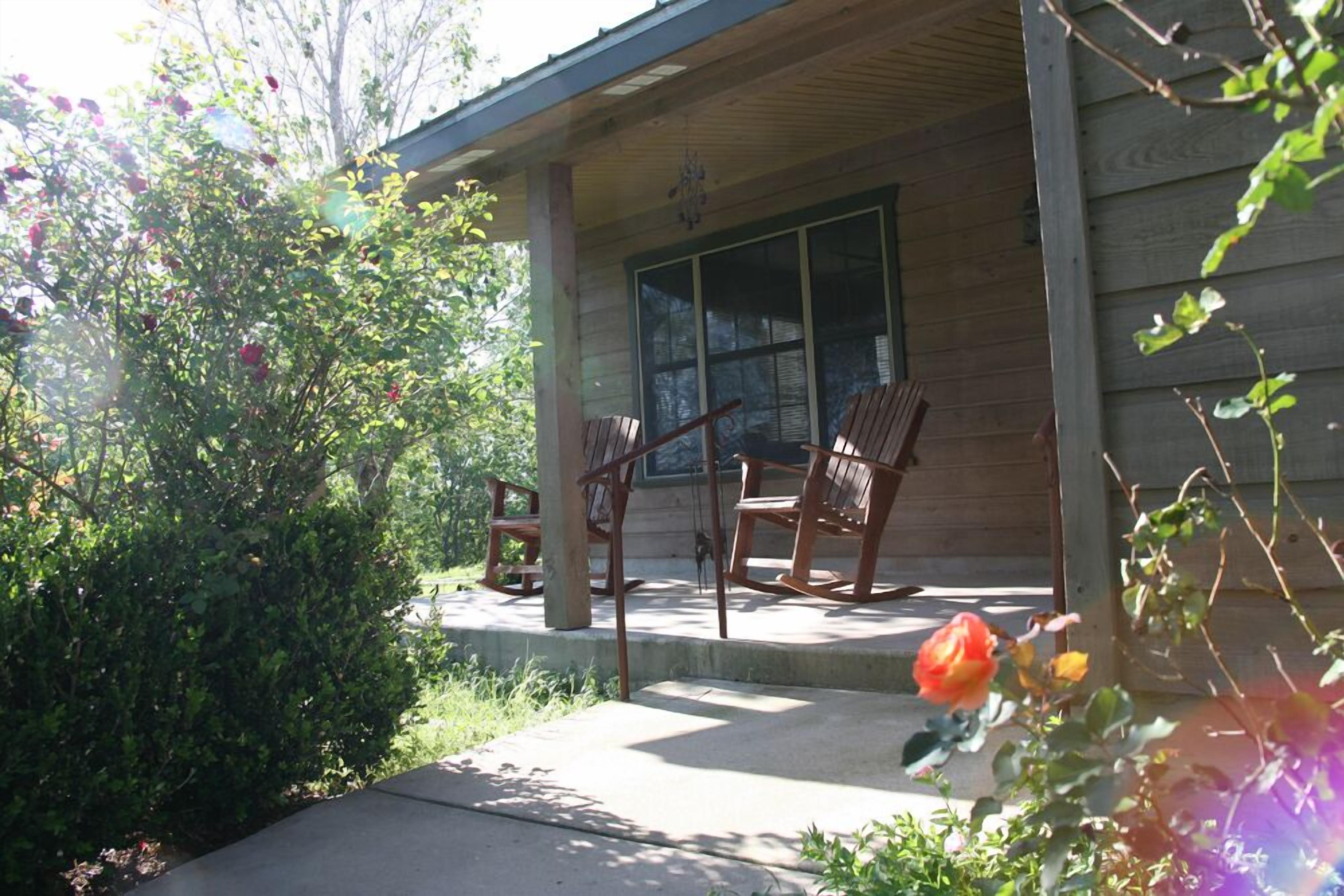 Rockers on the front porch allow you to view the beautiful flowers.