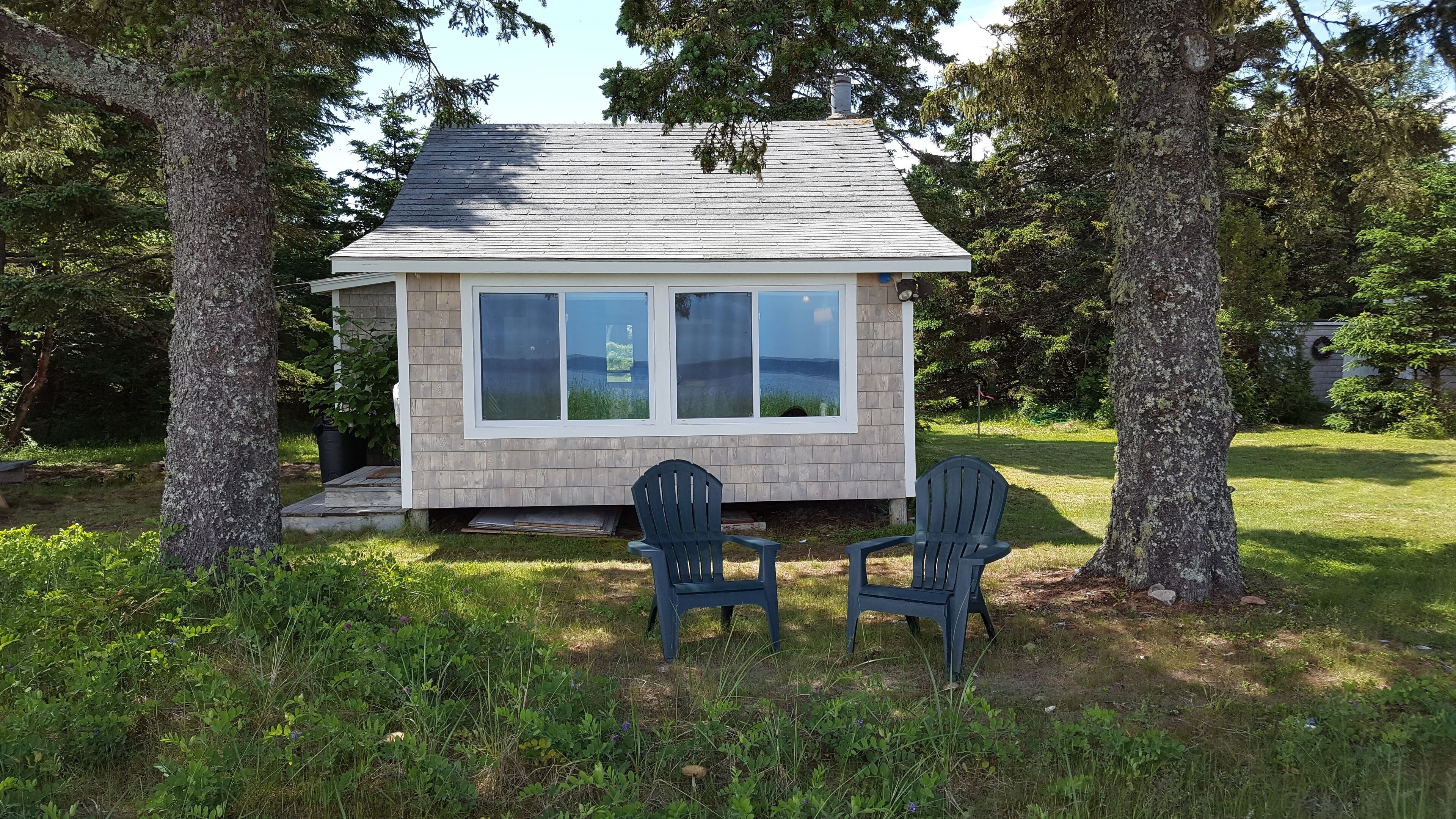 Nestled within spruce and sweet peas, your front row seat to Sandy River Beach.
