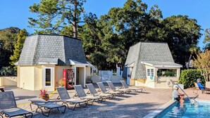 A pool area with lounge chairs and a Coca-Cola vending machine. - Shipyard: 271 Evian Island Villa-Relaxing Setting Weekly Rates Discounted (Hilton Head Island)