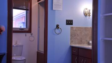 Shower, hair dryer, towels, toilet paper