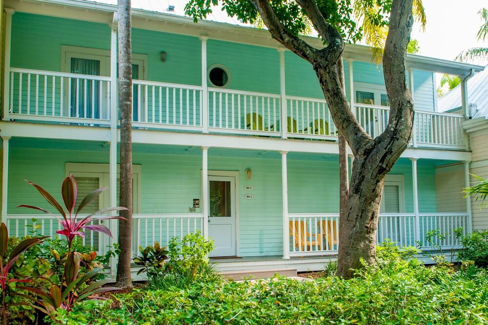 We stick to a Saturday check in during the in season months (Jan-April)<br><br>Greetings from Paradise, where the temperature is 82 degrees, water temperature 80, and the wind SE at 10, just enough breeze to blow sand in my margarita.<br><br>\'Margarita Villas\' are located in historic Old Town in a beautiful, very private gated compound that has won awards as the best development in Florida. (And yes it does have a blender).<br><br>It’s just off Duval Street, with its bustling shops and nightlife; yet quiet and private. Fort Zachary Taylor on the south side of the property has one of our most picturesque beaches located among the tall whispering pines of the uplands; the view of the reef and the turquoise waters is magnificent.<br><br>The heated pool is conveniently located nearby so you are never far from a refreshing dip or just \'conching out\' in the sun.<br><br>There are two bedrooms and one baths; the master bedroom is furnished with a queen-size bed, the other, two twins. French doors in the living room open onto the garden deck for outdoor dining or to catch the tropical breezes. Outdoor porch furniture on the deck.<br><br>The kitchen is completely equipped (including the mandatory BLENDER).<br><br>Fully air-conditioned, all rooms have tropical ceiling fans and all linens are provided. There is off street parking for one car.<br><br> <br>Mike Wernicoff<br><br>PS: Did I mention that we have a BLENDER?<br><br>Keywords: Condominium Truman Annex Best Location in Town