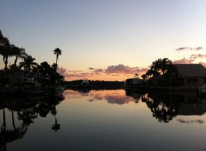Enjoy a tranquil waterfront setting with a clear view of the water and surrounding structures.