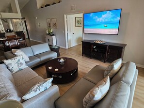Smart TV, books, stereo - Relax on the oversized lanai featuring an outdoor kitchen and mid-water view. (Naples)