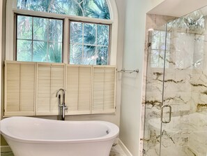 Bathtub, hair dryer, towels, soap