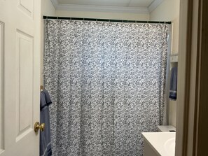 Combined shower/tub, hair dryer, towels, toilet paper