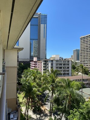 Experience the tropical ambiance of this high-rise building, surrounded by lush greenery and modern architecture.