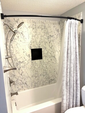 Combined shower/tub, hair dryer, towels, shampoo