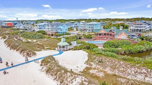 A coastal residential area with beachfront properties, a walking path, and a small gazebo. - Beautiful Southport, Golf Frontage & Oak Island Beach club .New Quartz counters  (Southport)