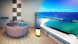 A spa area with a large hot tub, a small table, and a wall-mounted heater.