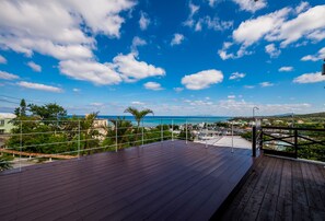Enjoy a tranquil view from this deck overlooking the surrounding landscape.