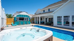A backyard with a swimming pool, a hot tub, and outdoor furniture. - 632 Private Pool, Hot Tub, Billiards, and More! (Corolla)