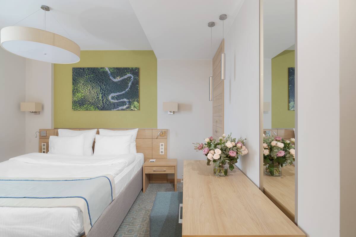Deluxe Room, 1 King Bed | In-room safe, individually decorated, individually furnished, desk