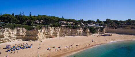 On the beach, sun-loungers