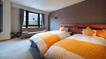 Family Room | Premium bedding, in-room safe, blackout drapes, soundproofing