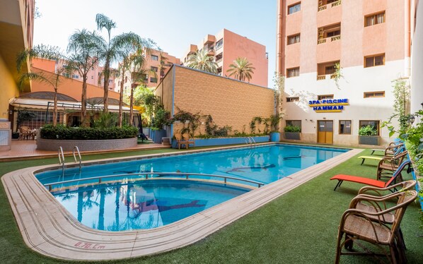 Outdoor pool, pool umbrellas, pool loungers