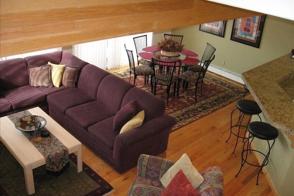 Main living, dining and kitchen area on main floor. Attached balcony with view