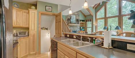 Dishwasher, coffee/tea maker, cookware/dishes/utensils, dining tables