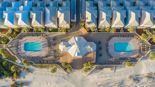 An aerial view of a resort with multiple buildings, two swimming pools, and a central courtyard. - Stay @ Serenity by the Sea on Isle of Palms (Isle of Palms)