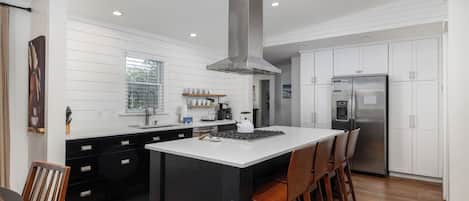 Fridge, dishwasher, coffee/tea maker, cookware/dishes/utensils