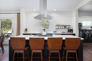 Fridge, dishwasher, coffee/tea maker, cookware/dishes/utensils
