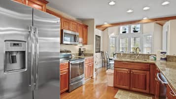 Dishwasher, coffee/tea maker, cookware/dishes/utensils, dining tables