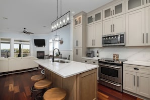 Fridge, dishwasher, coffee/tea maker, cookware/dishes/utensils
