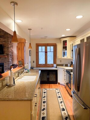 Dishwasher, coffee/tea maker, cookware/dishes/utensils, dining tables