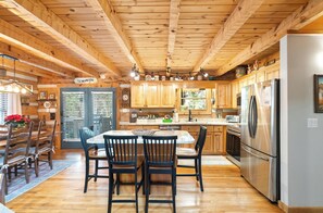 Dishwasher, coffee/tea maker, cookware/dishes/utensils, dining tables