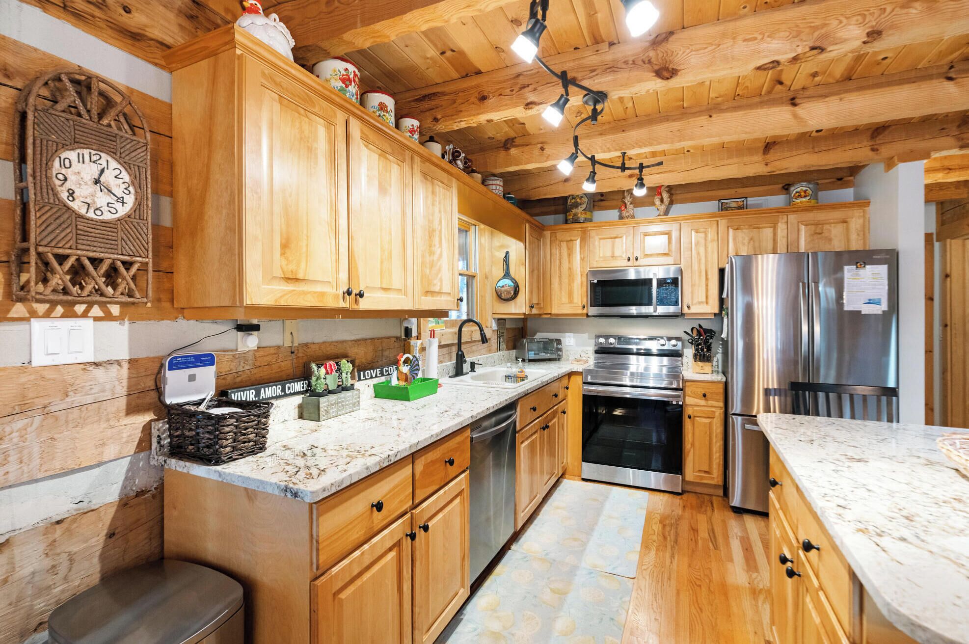 Dishwasher, coffee/tea maker, cookware/dishes/utensils, dining tables