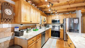 Dishwasher, coffee/tea maker, cookware/dishes/utensils, dining tables