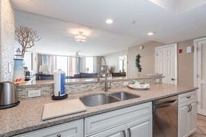 Fridge, dishwasher, coffee/tea maker, cookware/dishes/utensils