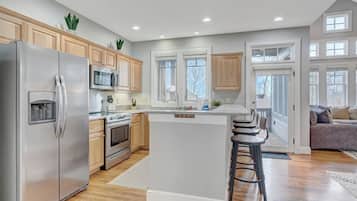 Dishwasher, coffee/tea maker, cookware/dishes/utensils, dining tables