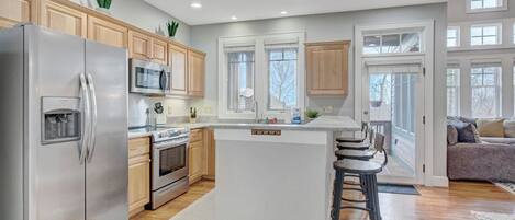 Dishwasher, coffee/tea maker, cookware/dishes/utensils, dining tables