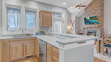 Dishwasher, coffee/tea maker, cookware/dishes/utensils, dining tables