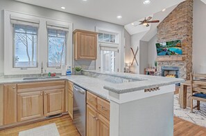 Dishwasher, coffee/tea maker, cookware/dishes/utensils, dining tables