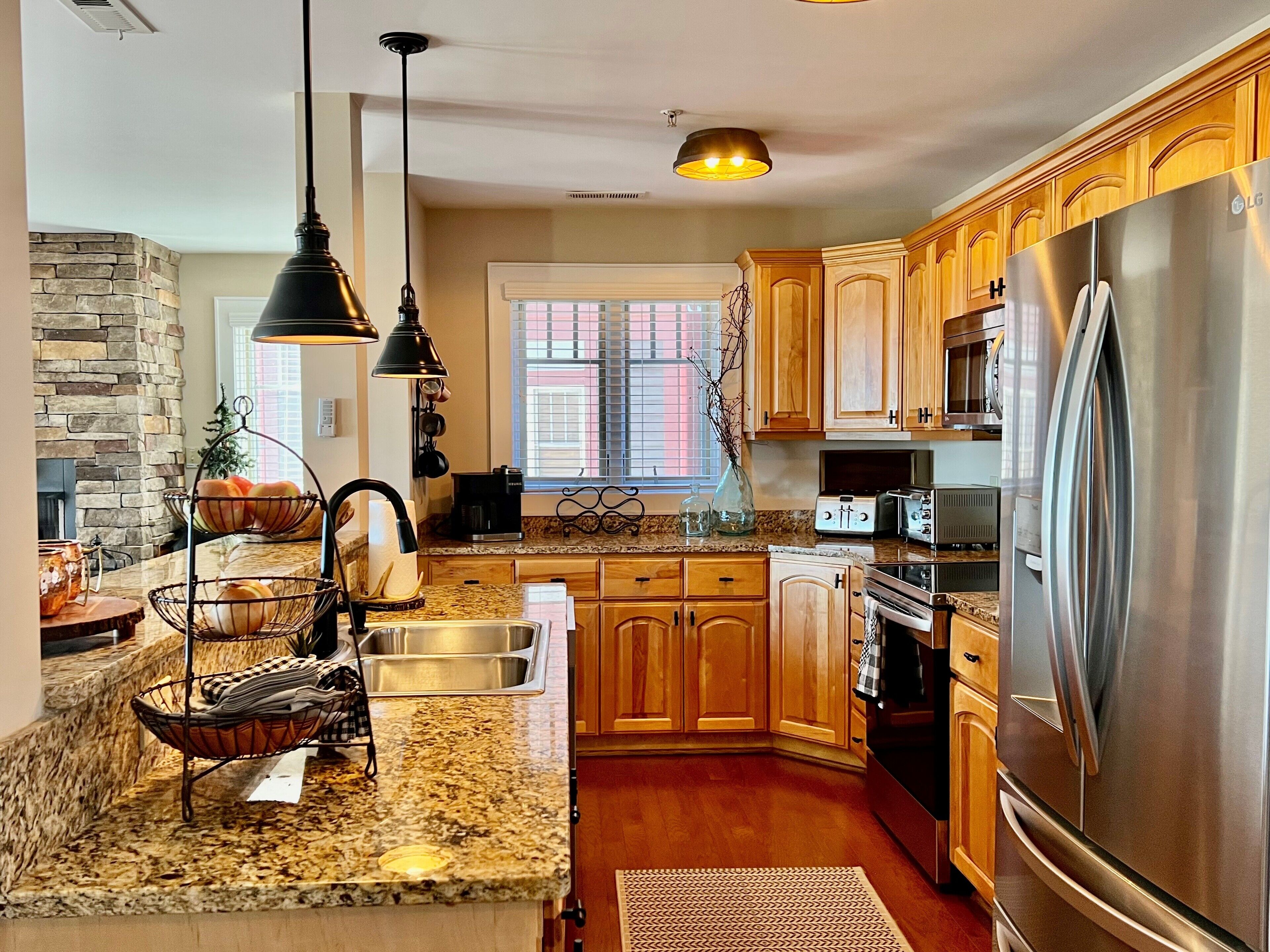 Dishwasher, coffee/tea maker, cookware/dishes/utensils, dining tables