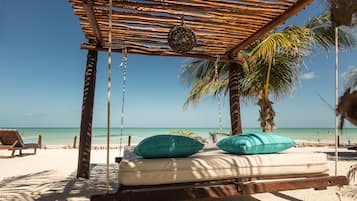 On the beach, sun-loungers, beach towels