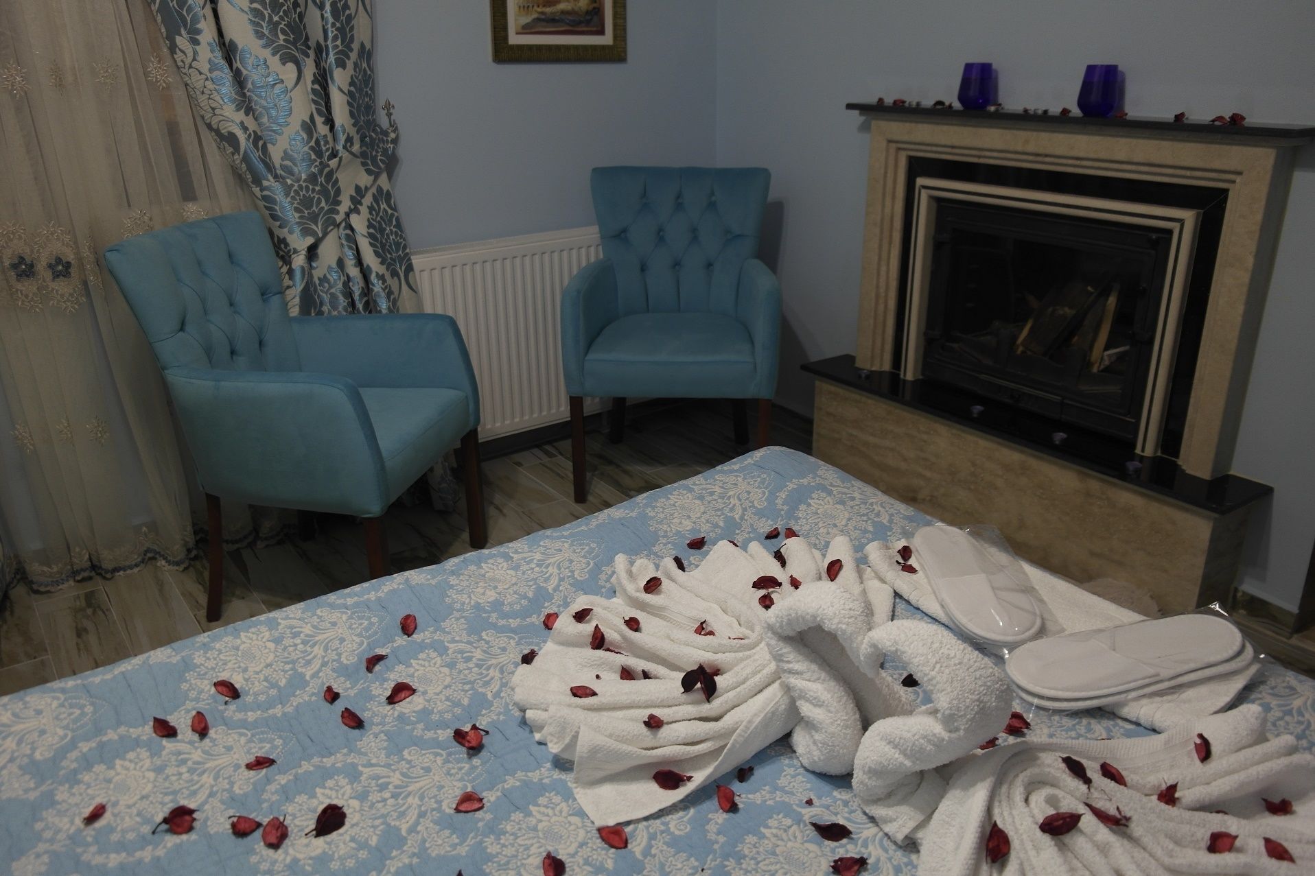 deluxe room, fireplace | living area | lcd tv